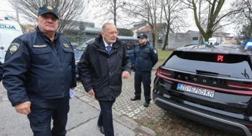 Interior Minister Božinović viewing Border Police vehicles 