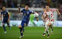  Takehiro Tomiyasu i Ivan Perišić , Foto: Dylan Martinez/REUTERS