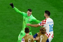 Dominik Livaković slavi s igračima, Foto: Fabrizio Bensch/REUTERS
