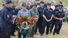 Members of the firefighting community pay their respects to the victims