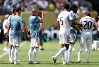 Luka Modrić s klupe razgovara s Bellinghamom, Foto: Lee Smith/REUTERS
