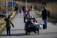 Ljudi prelaze ukrajinsko-poljsku granicu, Foto: Bryan Woolston/REUTERS