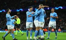 Haaland slavi sa suigračima svoj treći pogodak, Foto: Molly Darlington/REUTERS